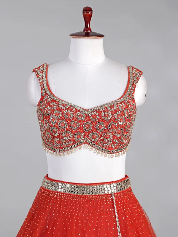 Rust red net lehenga choli with sparkling sequins