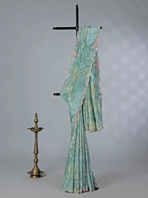Sage green crepe silk saree with sequins and mirror work