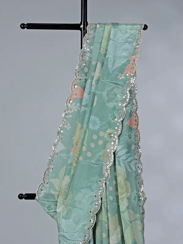 Sage green crepe silk saree with sequins and mirror work