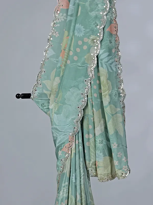 Sage green crepe silk saree with sequins and mirror work