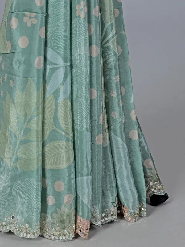 Sage green crepe silk saree with sequins and mirror work