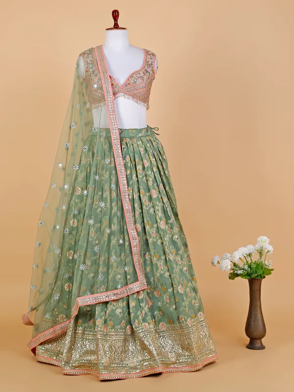 Sage green organza lehenga choli with duatta