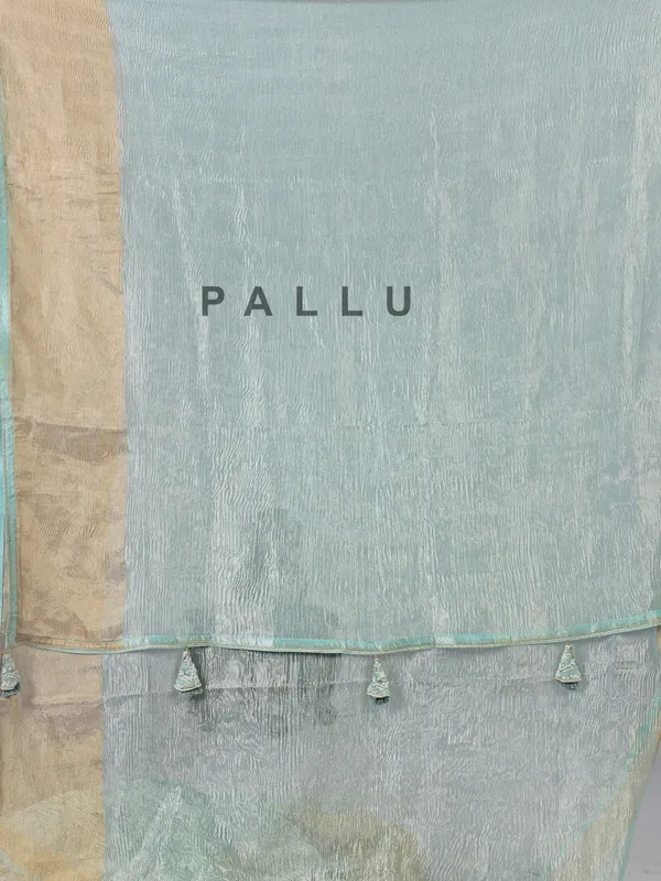 Sage green organza saree with zari weaving