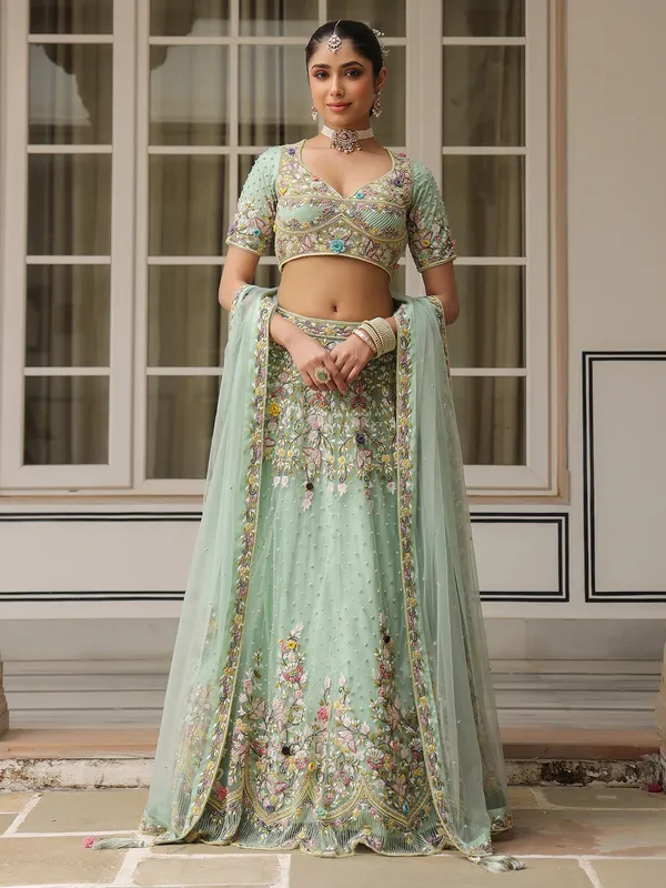 Sea green net lehenga choli for weddong wear