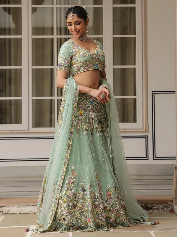 Sea green net lehenga choli for weddong wear