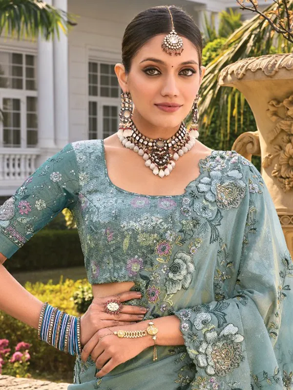 Sea green organza saree for festive elegance