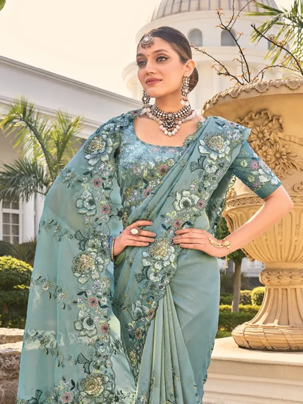 Sea green organza saree for festive elegance