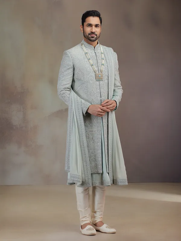 Sea green silk groom sherwani with dupatta