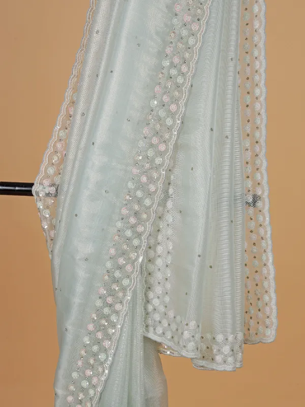 Sequin worked mint green organza saree