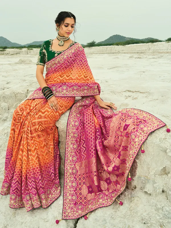Shaded orange and rani color bandhej georgette saree