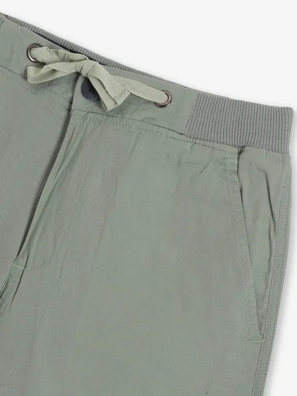 SHIELD pista green cotton shorts