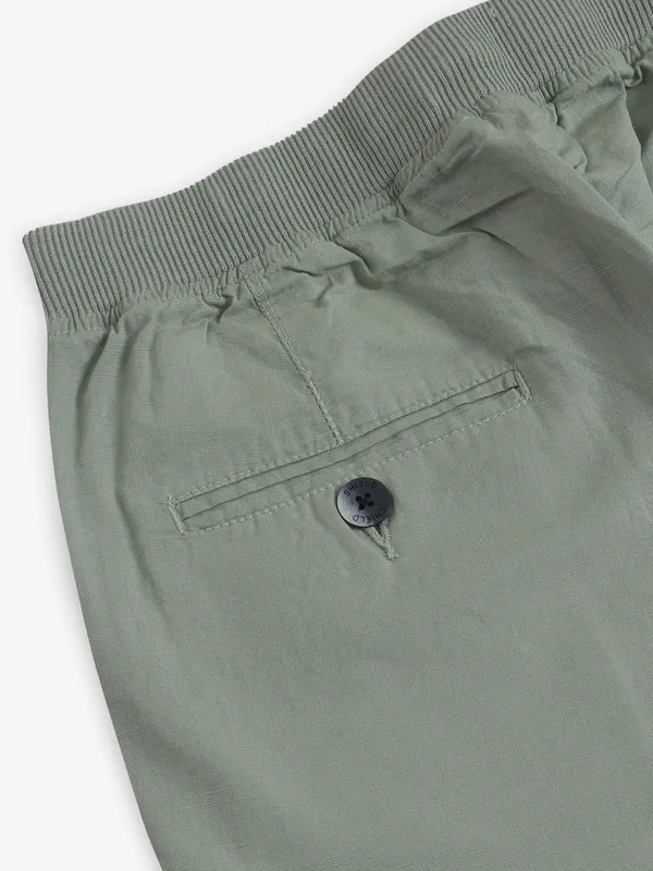 SHIELD pista green cotton shorts