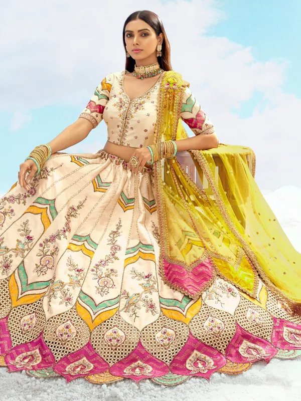 Silk cream lehenga choli with net dupatta