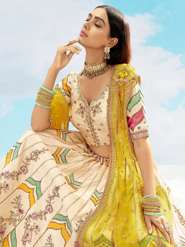 Silk cream lehenga choli with net dupatta