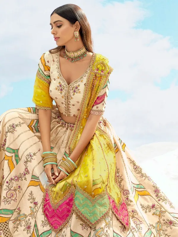 Silk cream lehenga choli with net dupatta