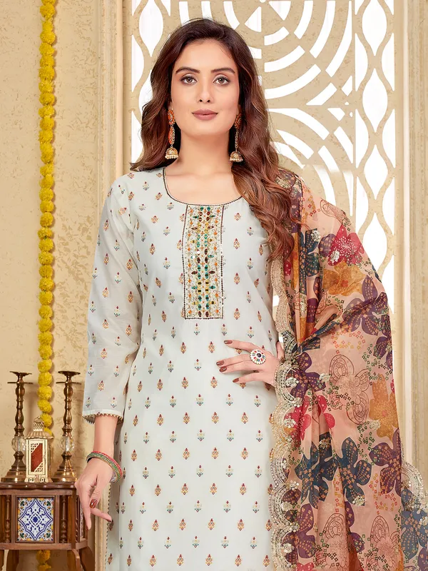 Silk embroidery salwar suit in off white