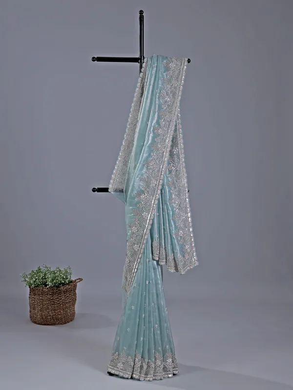 Sky blue tissue silk saree with rich cutdana embellishment