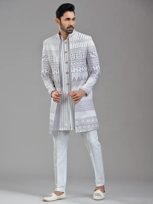 Sophisticated white silk jacket style indowestern with resham
