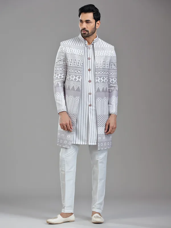 Sophisticated white silk jacket style indowestern with resham