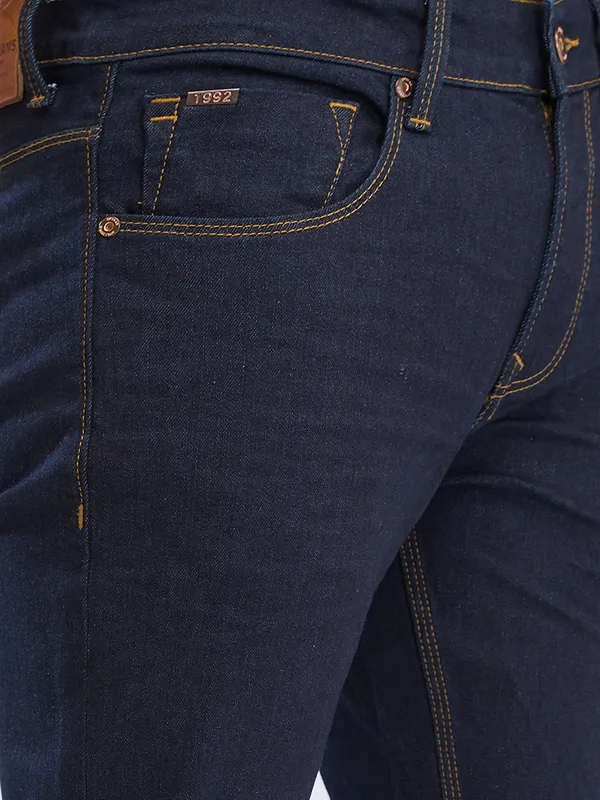 SPYKAR solid navy slim fit denim for men