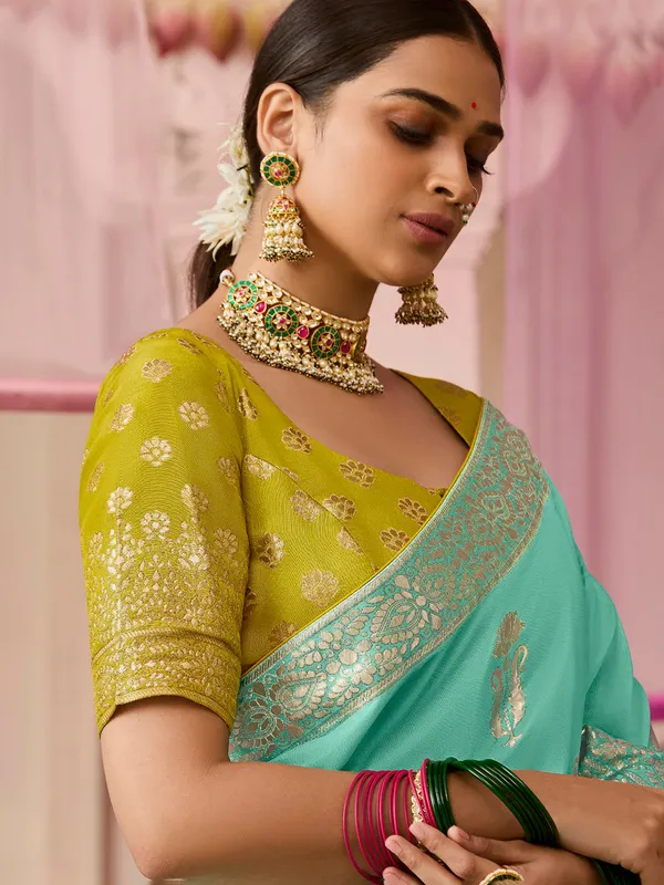 Stnning mint green saree with contrast border