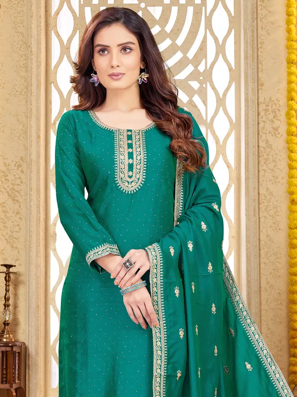 Stnning teal green silk salwar suit