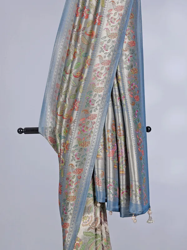 Stone blue shimmer dola silk saree with zari and print