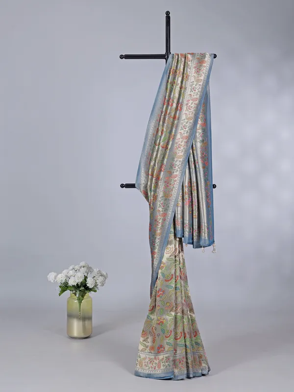 Stone blue shimmer dola silk saree with zari and print