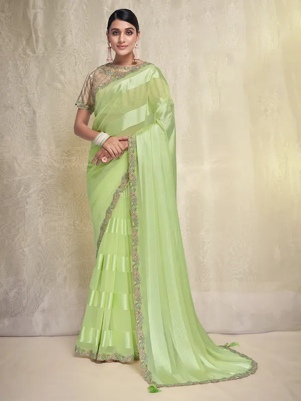 Stuniing light green georgette saree