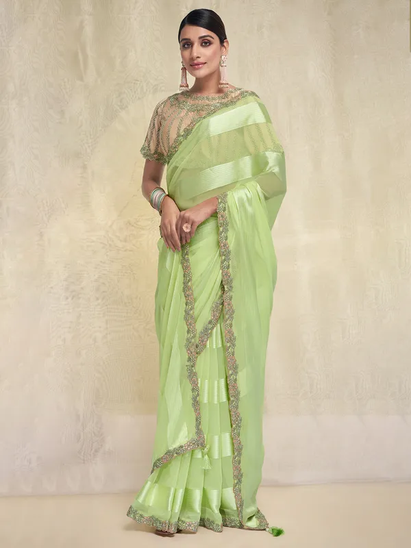 Stuniing light green georgette saree