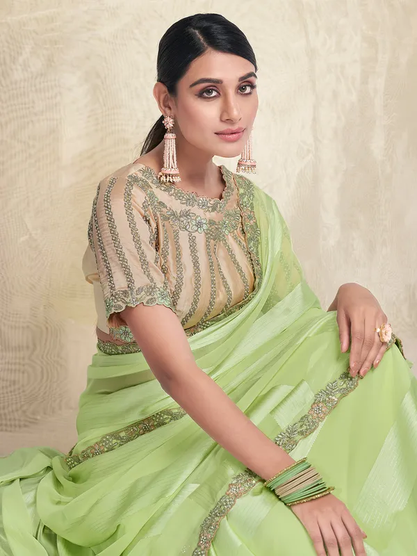 Stuniing light green georgette saree
