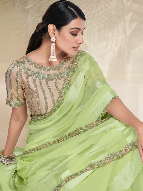 Stuniing light green georgette saree