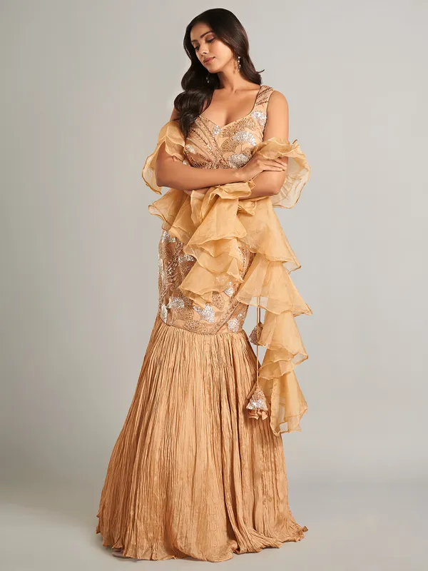 Stunning beige lehenga choli with ruffle dupatta