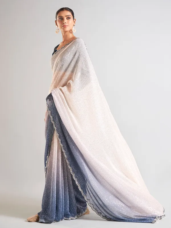 Cream and blue sequins saree