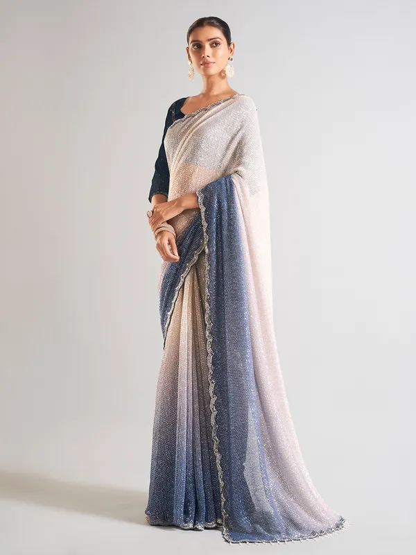 Cream and blue sequins saree