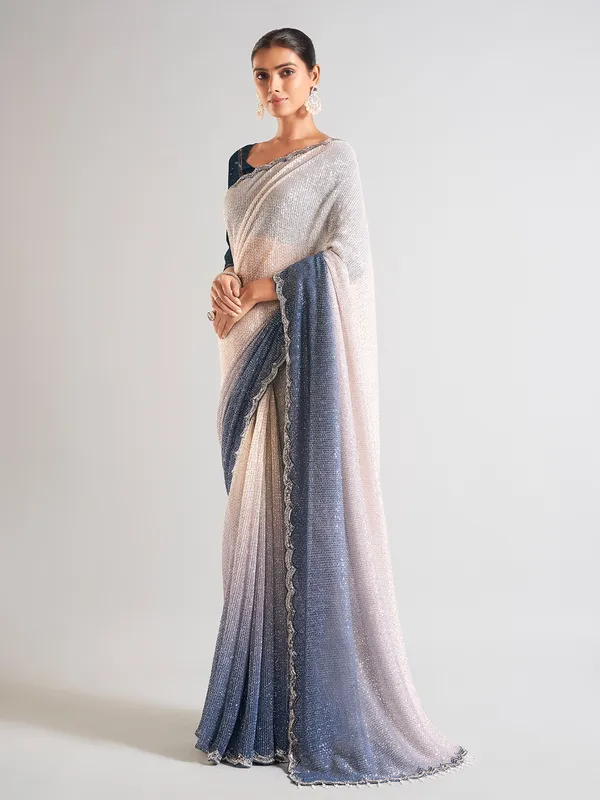 Cream and blue sequins saree