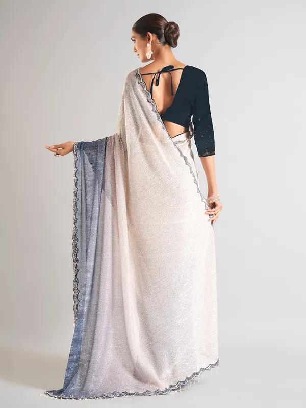 Cream and blue sequins saree