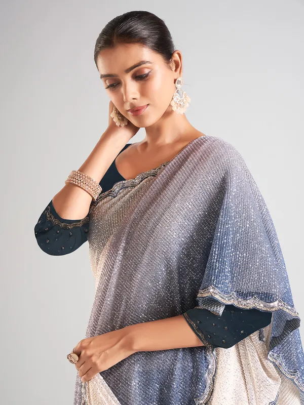 Cream and blue sequins saree