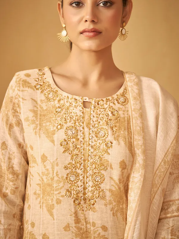 Stunning cream kurti set in silk with heavy work