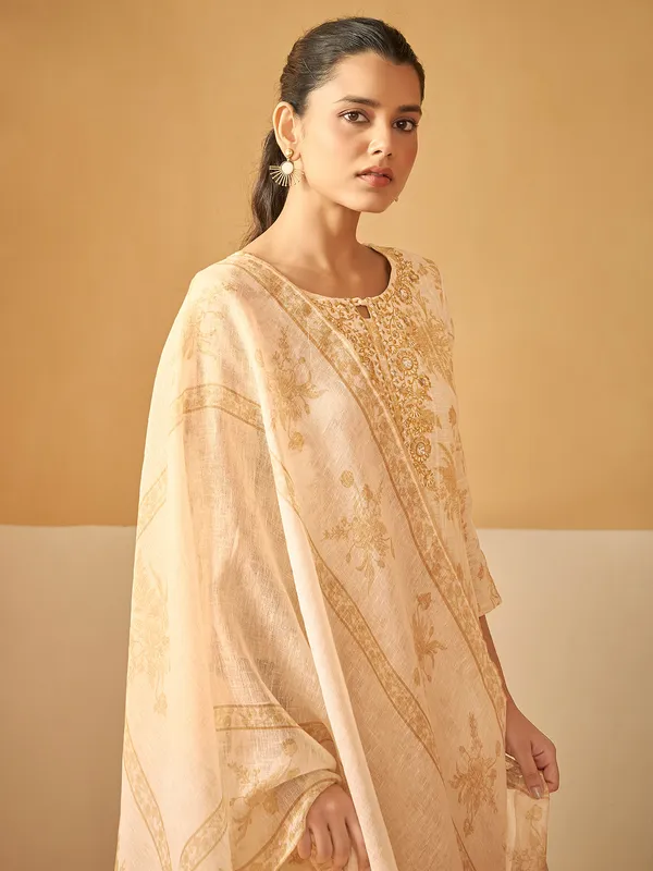 Stunning cream kurti set in silk with heavy work