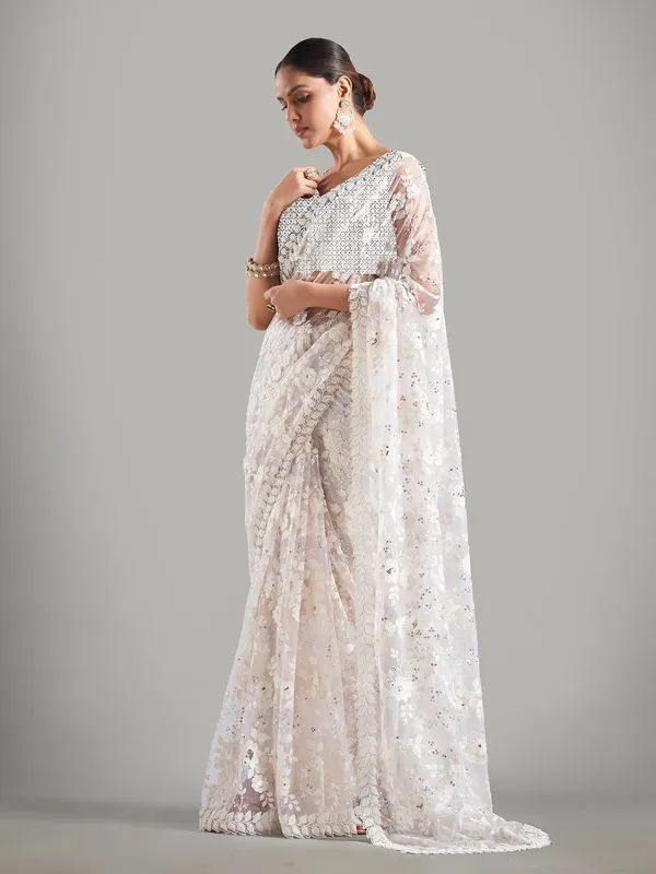 Stunning cream net saree for reception