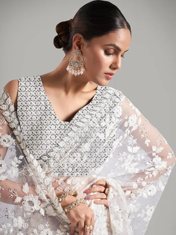 Stunning cream net saree for reception