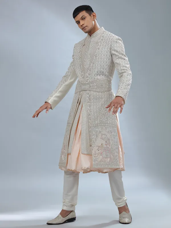 Stunning Off white and peach silk peshwai sherwani