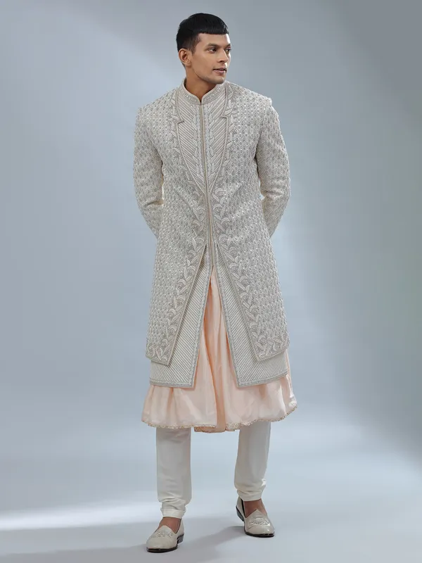 Stunning Off white and peach silk peshwai sherwani