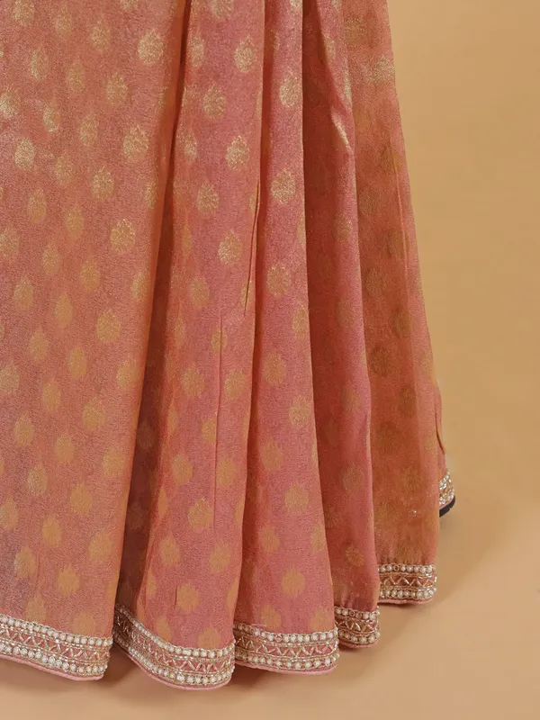 Stunning peach chiffon saree for wedding
