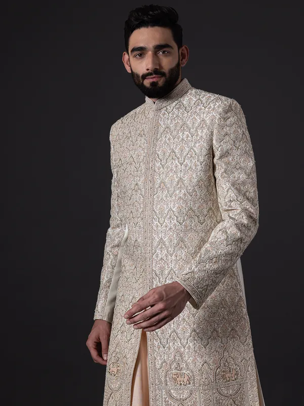 Stunning peach silk wedding sherwani for groom
