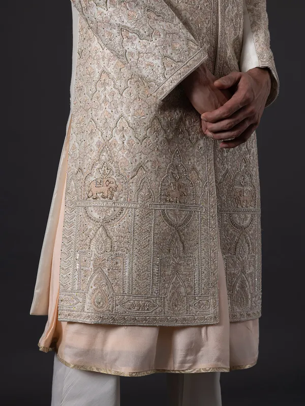 Stunning peach silk wedding sherwani for groom