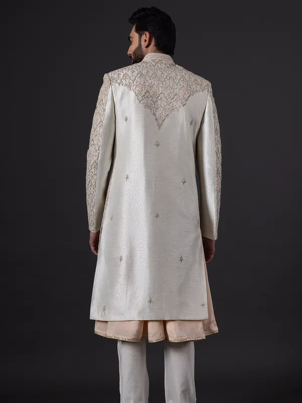 Stunning peach silk wedding sherwani for groom