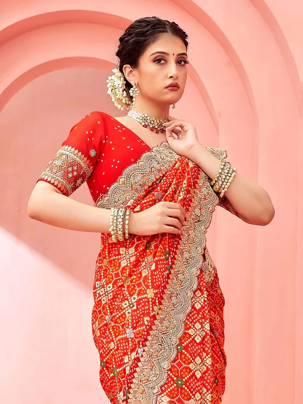 Stunning red bandhej printed saree