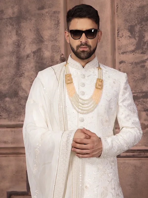 Stunning silk white groom sherwani